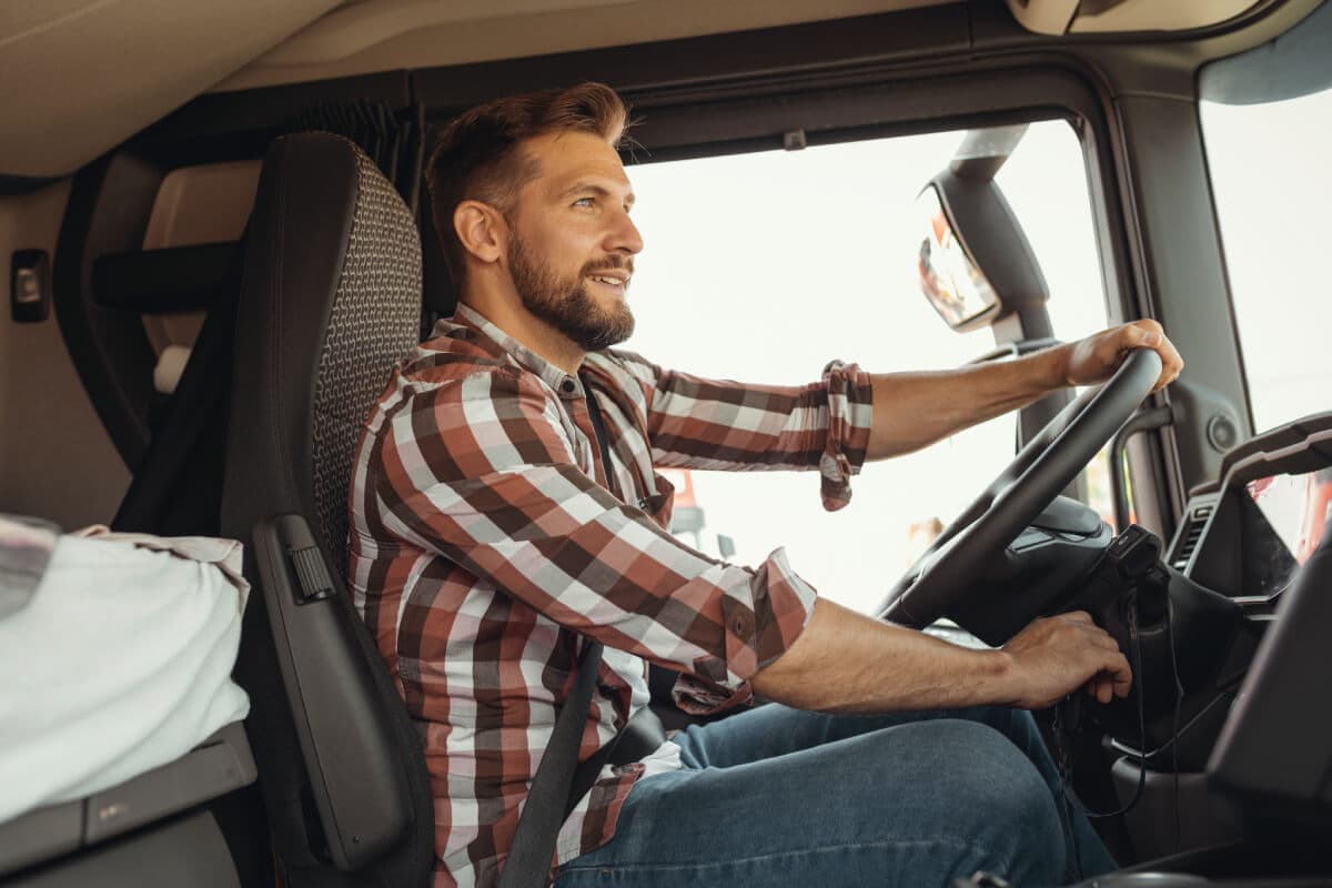 a-happy-trucker-operating-a-truck-owner-operator-insurance.jpg