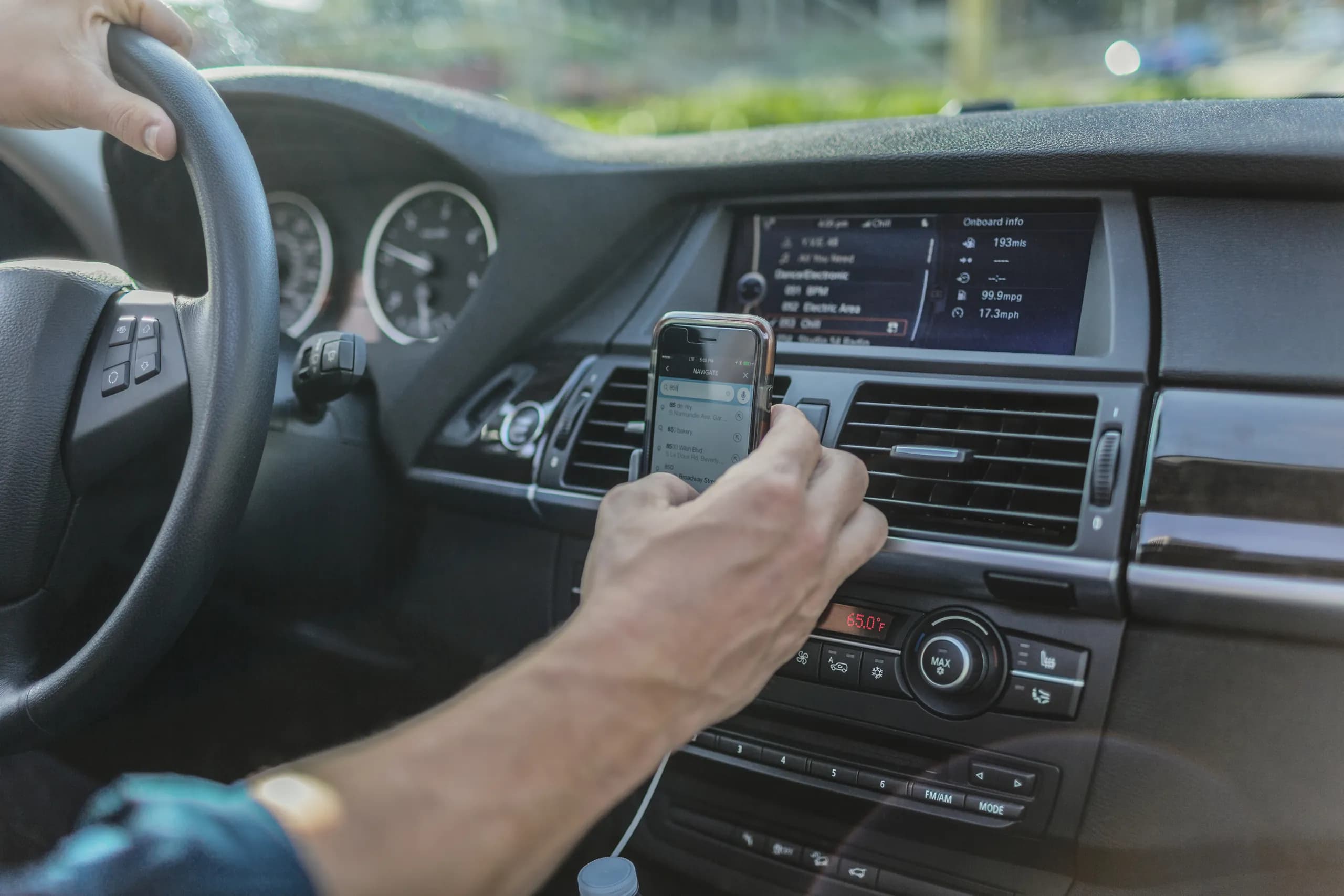 Person using navigation in their car.